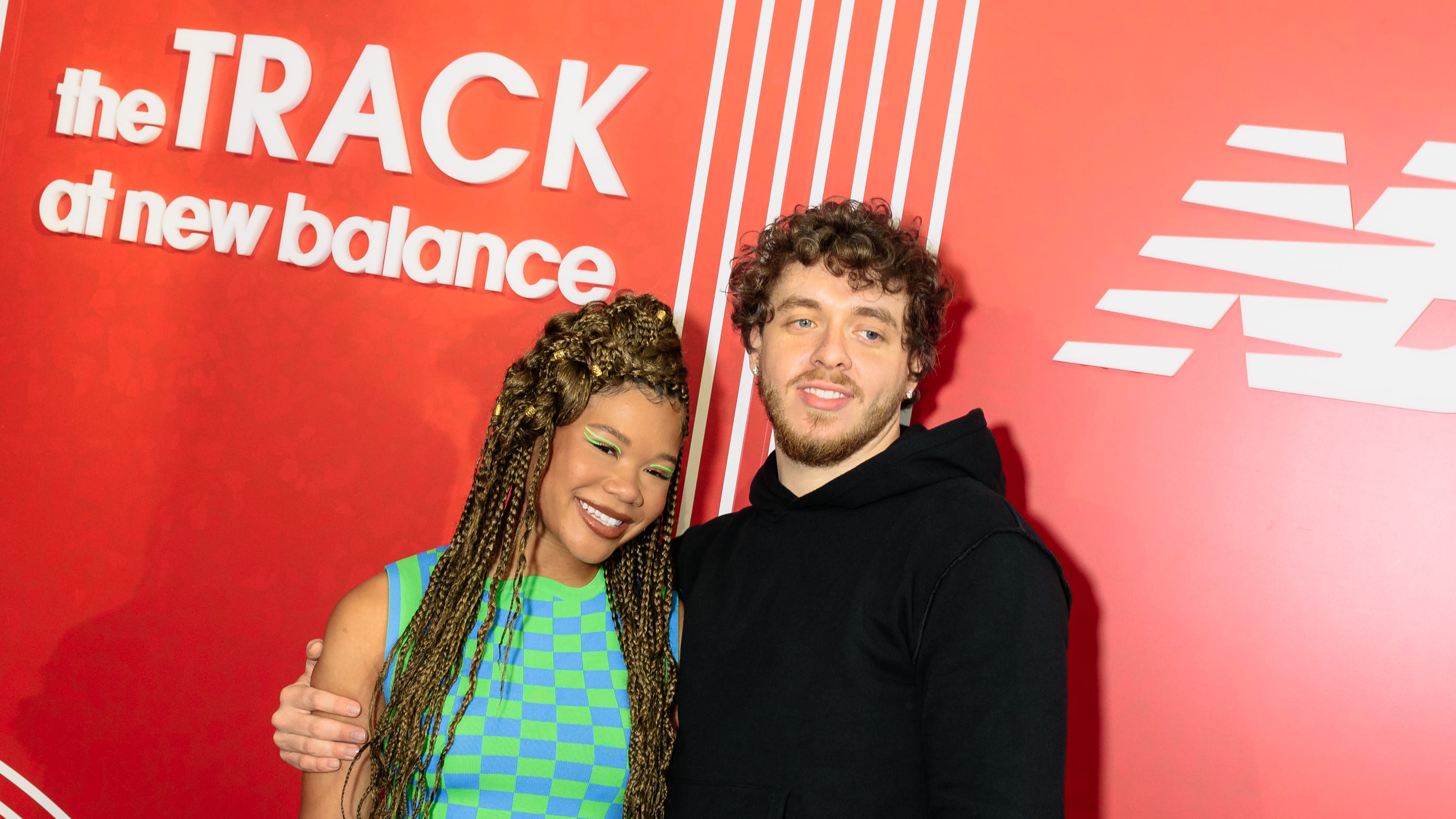 Jack Harlow and Storm Reid pose at the opening of The Track at New Balance