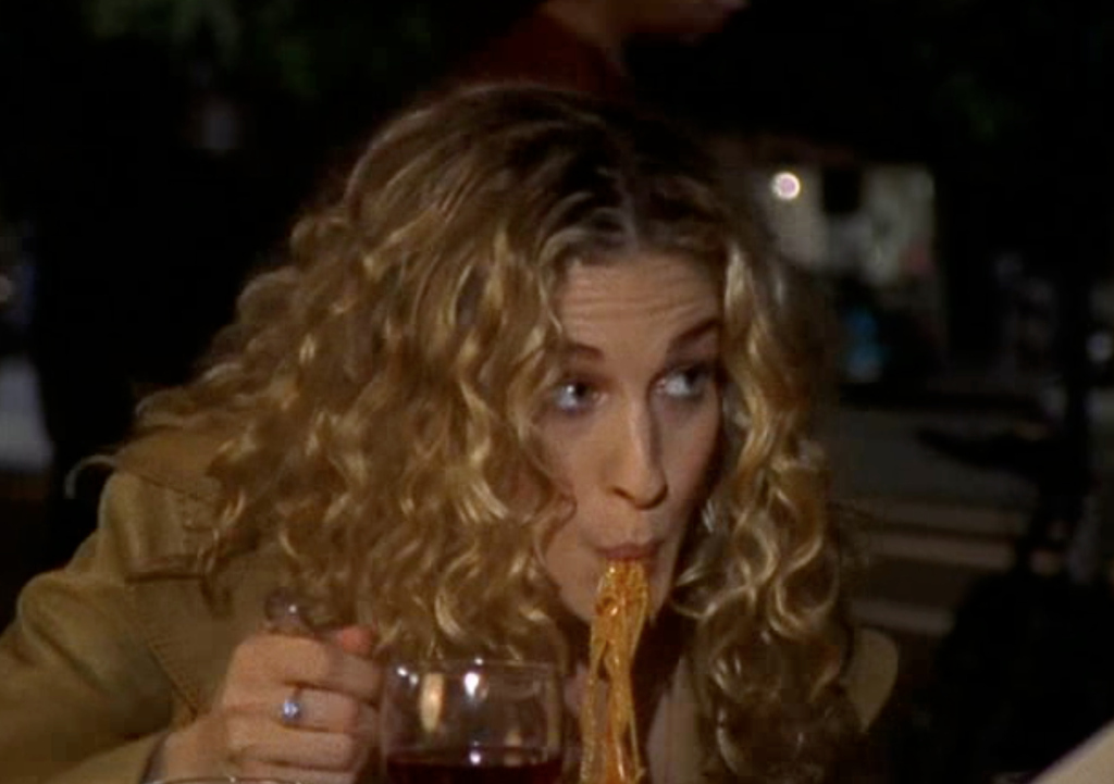 12 Times Carrie Bradshaw Forgot How To Eat Food