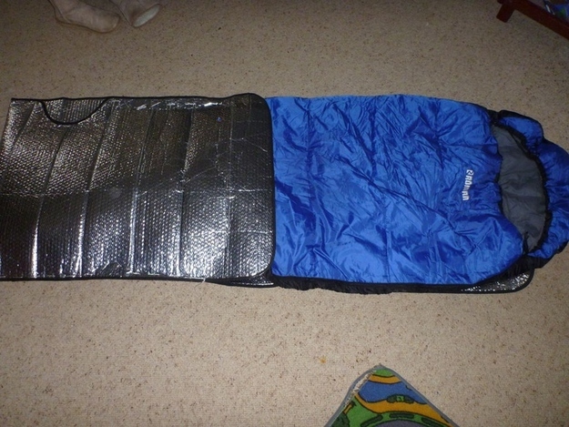 Double insulate your sleeping bag the DIY way with two car windscreen heat reflectors.