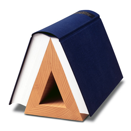 This functional sculpture is called the Book Hook and is available for 30 Euros (about $41) at Connox.