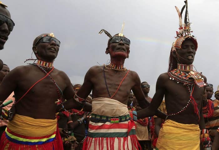 Turkana men dance and sing during the hybrid solar eclipse at the remote Sibiloi National Park. Local myths in northern Kenya attribute the event to the Moon eating the Sun.