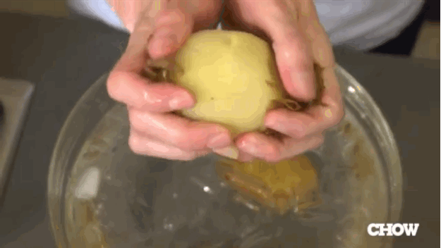 Just shock them in ice water when they're done and then slip the skin off with your hands.