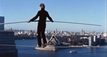 In 1974, Phillippe Petit stepped out onto an illegal wire strung between the Twin Towers, and tight-roped walked across. Why? "When I see two towers, I walk."