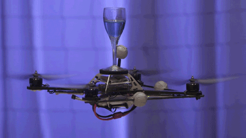 Do you see this? This drone is balancing a glass of water as if it's not even a thing! Soon you'll even be able to have an Amazon drone deliver your packages.