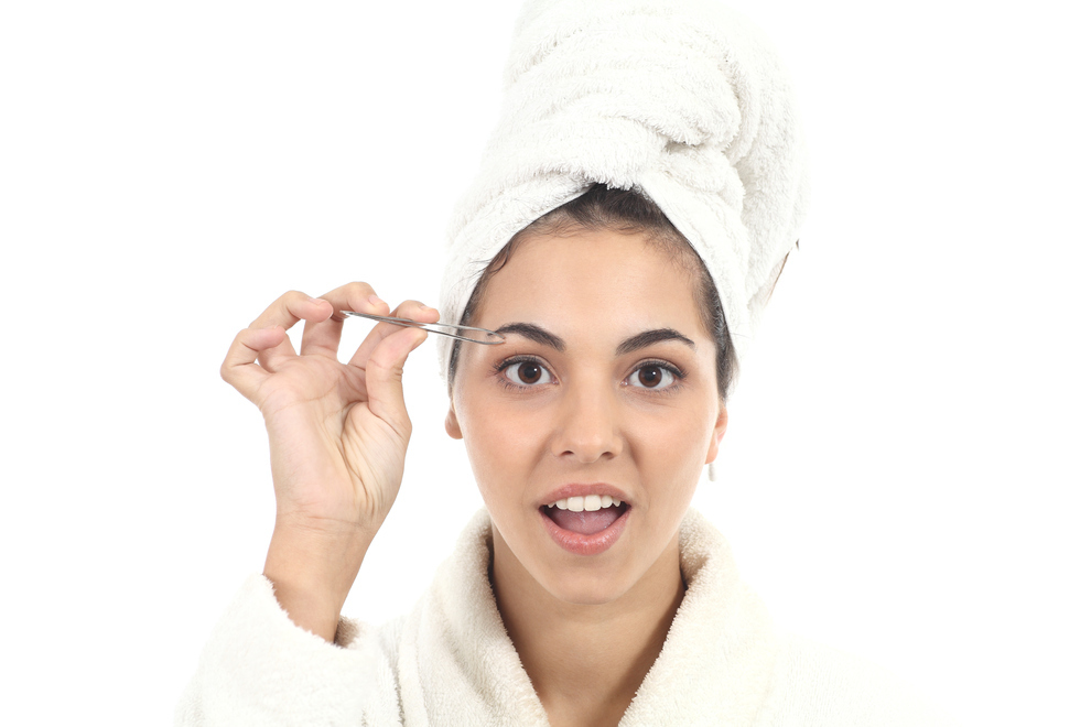 Take it easy on yourself and open up your pores so the hair slides out better. The steam from the shower or a hot compress is perfect for this process. And if you're plucking a sensitive area, like the middle of a unibrow, the heat will make it a little less painful. Source