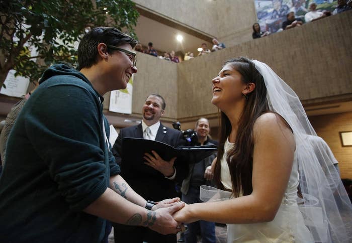 Jax Collins (left) and Heather Collins get married at the Salt Lake County Government Building in Salt Lake City, Utah, Dec. 23, 2013.
