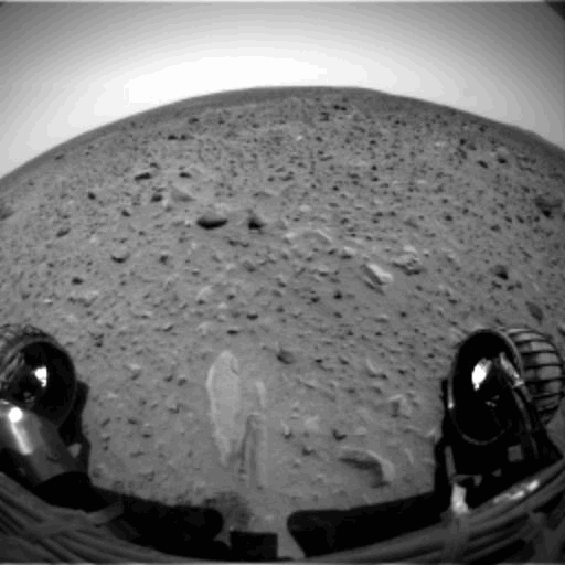 Spirit is seen roving during an approximately 21.2-meter (69.6-foot) drive across the pebbly ground at Gusev Crater, Mars, on the 37th day, or sol, of its mission (Feb. 9, 2004) in these images captured by the rover’s front hazard-avoidance camera after it began the autonomous portion of its drive.