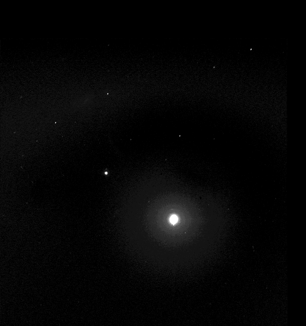 Taking advantage of extra solar energy collected during the day, Spirit settled in for an evening of stargazing, photographing the two moons of Mars as they crossed the night sky in the evening of Martian day, or sol, 590 (Aug. 30, 2005). In this view, the Pleiades, a star cluster also known as the “Seven Sisters,” is visible in the lower left corner. The bright star Aldebaran and some of the stars in the constellation Taurus are visible on the right.