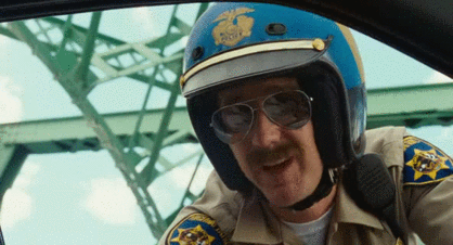 Fortunately the police officer wearing gross mustache and massive helmet played by Edward Norton takes off his sunglasses which makes it much easier to recognize him.