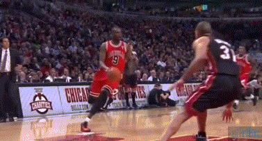 That's Jimmy Butler posterizing Chris Bosh on the alley-oop.