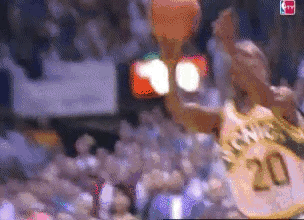 Shawn Kemp of the defunct Seattle Super Sonics (those uniforms though) flys to the basket like a missile on this alley oop.