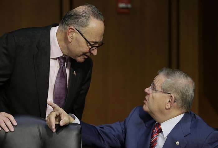 U.S. Senators Charles Schumer (D-NY) (L) and Robert Menendez (D-NJ) (R) talk before U.S. Treasury Secretary Jack Lew (not pictured) testifies before the Senate Finance Committee on the U.S. government debt limit in Washington October 10, 2013.