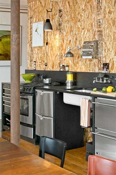 Architect Joseph Kennard wasn't yet sure where he wanted to mount items like wire shelving or a light over the sink when he was renovating his kitchen, so he needed a wall covering that was sturdy and inexpensive and would allow him to experiment. He opted for oriented strand board, a sheathing product with a textured-looking surface that's made from wood chips bound by adhesives. It's typically used beneath finished walls or floors, like plywood is. Using drywall screws, he mounted ½-inch-thick 4-by-8-foot sheets to the walls behind his sink and cooktop. "The material camouflages nail and screw holes, so I can relocate things without having to patch it up," he says.POPULAR: 47 Skills You Need to Survive Homeownership