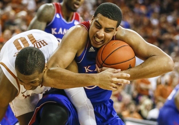 Texas' Jonathan Holmes (10) is called for a foul against Kansas' Landen Lucas in the first half at the Frank Erwin Center in Austin, Texas, on Saturday, Feb. 1, 2014. Texas won, 81-69. (Ricardo B.