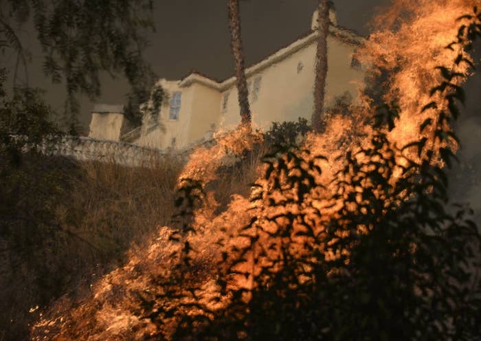 The Colby Fire burns near homes, in the hills of Glendora, Calif. on Jan. 16.