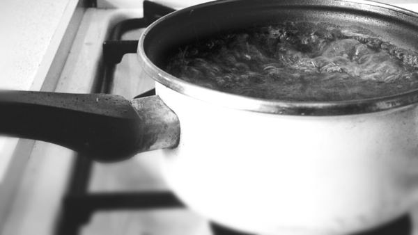 ...pour equal parts white vinegar and water into the pot or pan, then bring to a boil. That gunk will come right off.