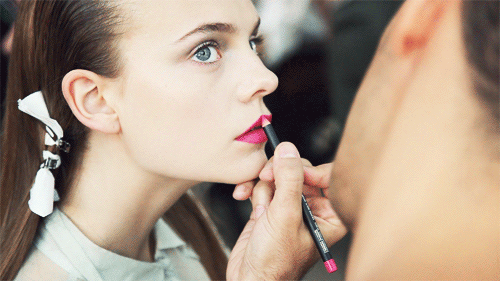 You use primer, lip liner, and a dab of translucent powder.