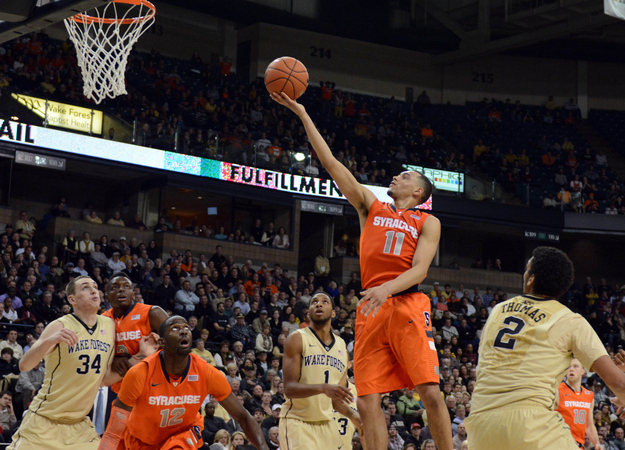 Jan 29, 2014; Winston-Salem, NC, USA; Syracuse Orange guard Tyler Ennis (11) lays the ball up during the second half against the Wake Forest Deamon Deacons at Lawrence Joel Veterans Memorial Coliseum. Syracuse won 67-57.