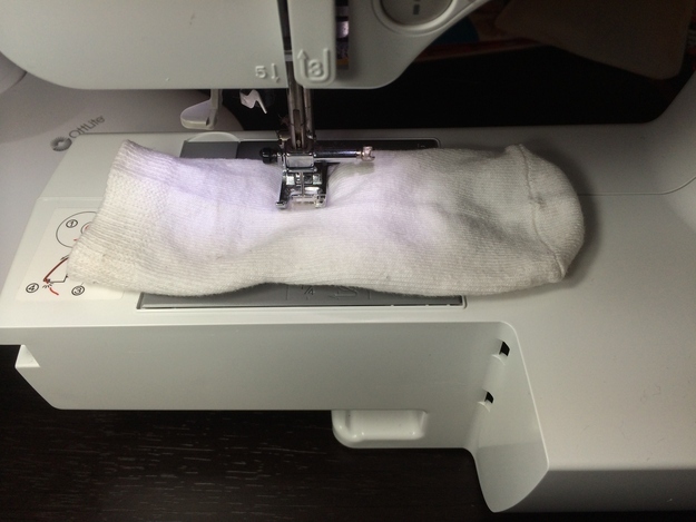 Sew one of your kid&#39;s socks closed halfway down.