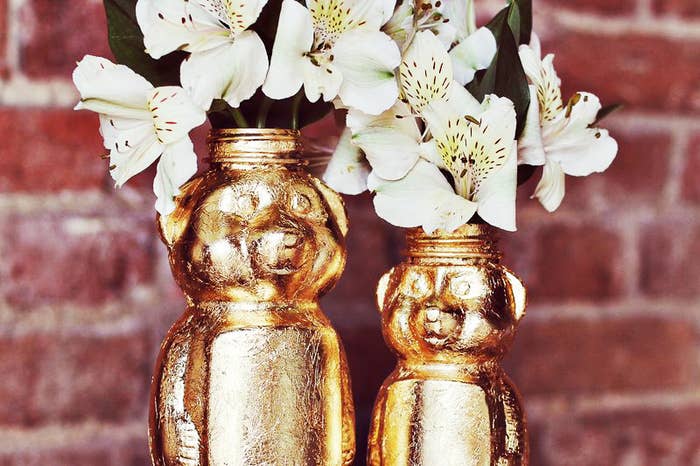 A little bit of gold paint turns just about anything, even used honey bottles, into standout end table accessories!