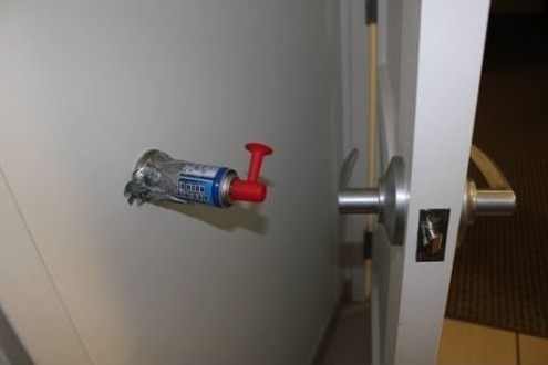 Tape an air horn to the wall next to the door.