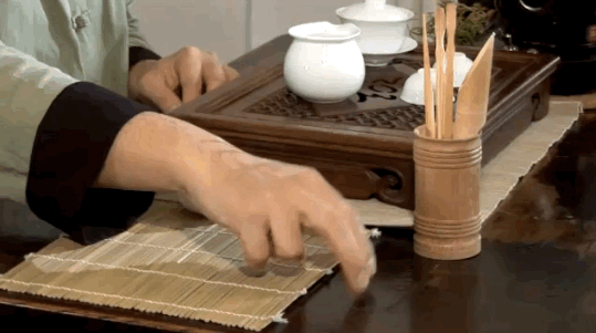 This was started by an emperor who often toured his kingdom undercover. He would pour tea for his guards, who couldn't blow his cover, so they bowed for the honor with their fingers.