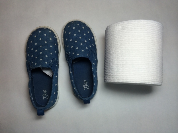 Stuff toilet paper into the toe of your kid&#39;s shoes.