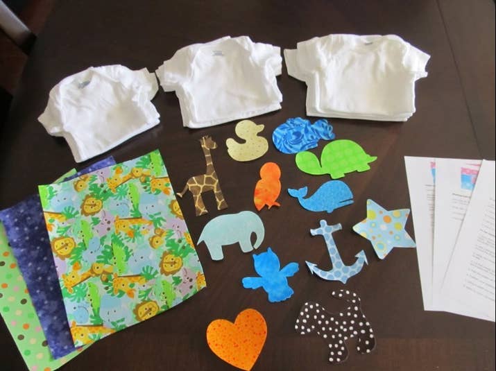 Set up a onesie decorating station. Having cute iron-ons already prepared ensures that even non-crafty guests can participate.