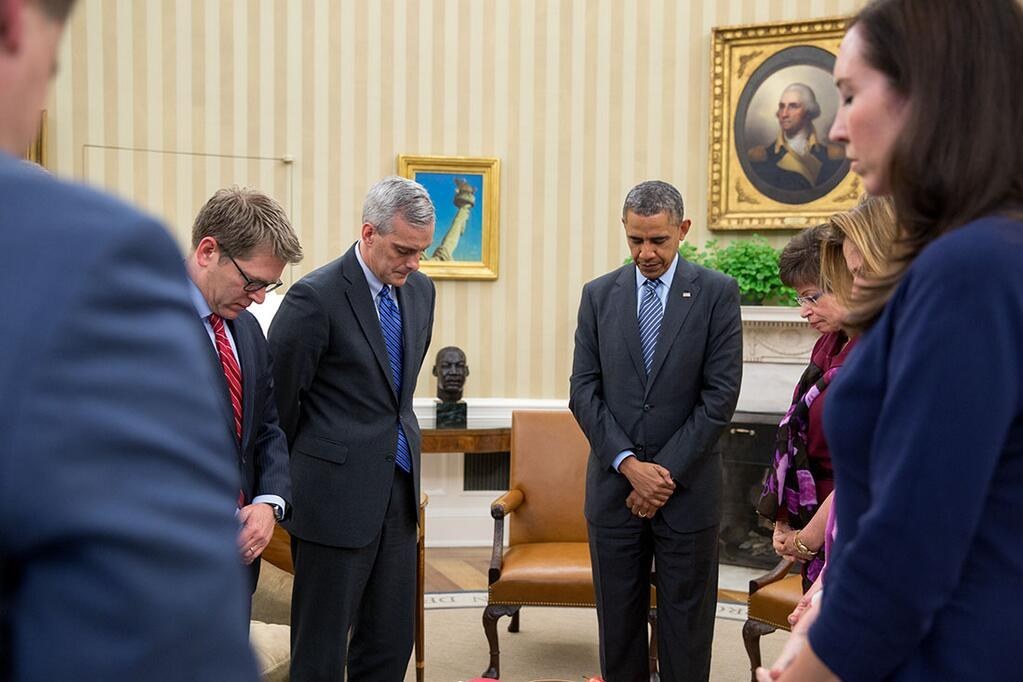 President Obama observes a moment of silence to honor the victims of the Boston Marathon bombing.