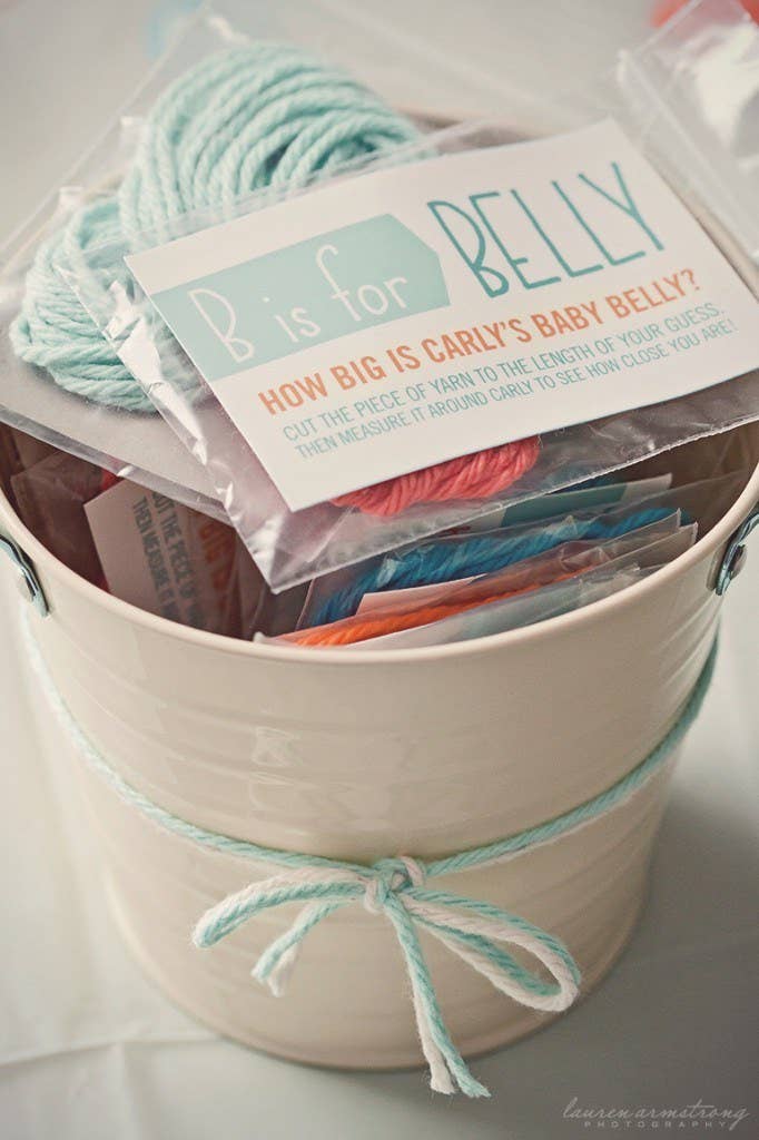 Have guests cut pieces of yarn to a length they think corresponds to the circumference of the mom-to-be's belly. Might as well have fun with the one time it's OK to comment on a woman's growing waistline.