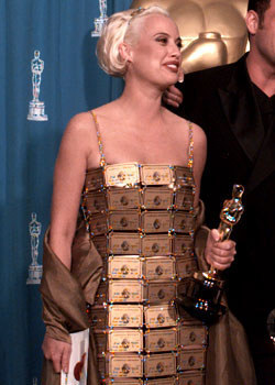 She won 'Best Costume Design' in 1995 for her work on the cult Aussie film, Pricilla: Queen of The Desert. She even wore this on the red carpet! A dress made up out of gold American Express cards!