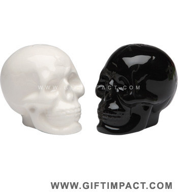 I own this pair! They really add a certain Gothic classiness to our dining table. Seems only natural to put the salt in the white one, the pepper in the black one. $8.99 (Gift Impact)