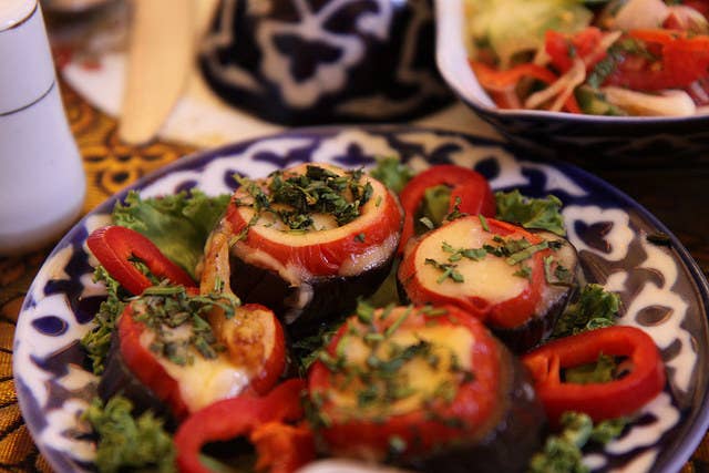 In Uzbek tradition, a meal usually starts off with some sort of salad appetizer, like this dish that combines freshly sliced eggplant, radishes and peppers on a bed of greens sprinkled with a garnish of parsley. Needless to say, most Uzbek dishes are meant to be shared family-style.