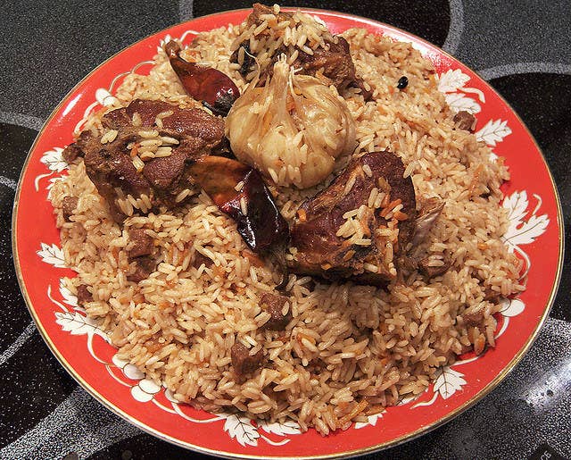 A delightful mixture of rice, bits of meat, grated carrots and onions, and raisins (with a clove of roasted garlic on top). The "wedding" part refers to the fact that it's easy to cook in large quantities (traditionally in a kazan over an open fire) and is often served on special occasions, like weddings.