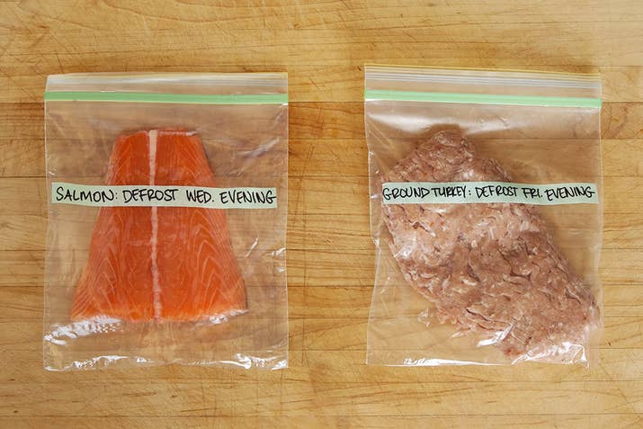 Label the bags, but instead of writing when you'll be eating it, write when to defrost it. If you want, set a phone alarm for Wednesday night, reminding you to move the salmon from the freezer to the fridge for Thursday's dinner. Set a similar alarm for Friday night, reminding you to defrost the ground turkey for Saturday.Salmon: 