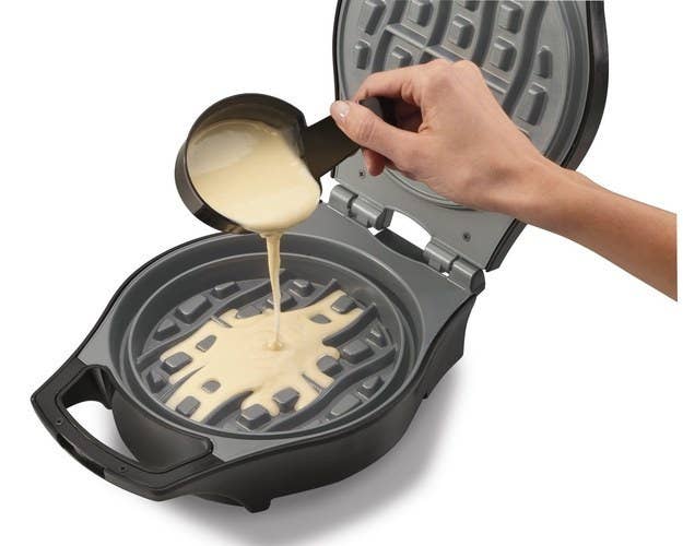 This Belgian waffle maker is tilted George Foreman Grill-style so that excess batter runs into an overflow channel, making for mess-free waffles (and easier cleanup). Buy it here for $25.52.
