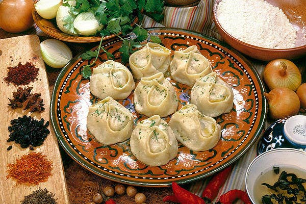 Steamed dumplings sprinkled with dill and served with sour cream. Meat, spices, or vegetables can make up the stuffing, so you never know what you're going to get!
