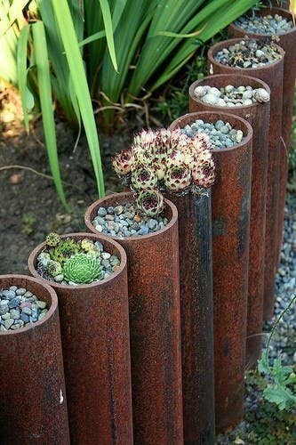 Fill the pipes with soil and plant succulents on top. You'll have the most meta garden ever.