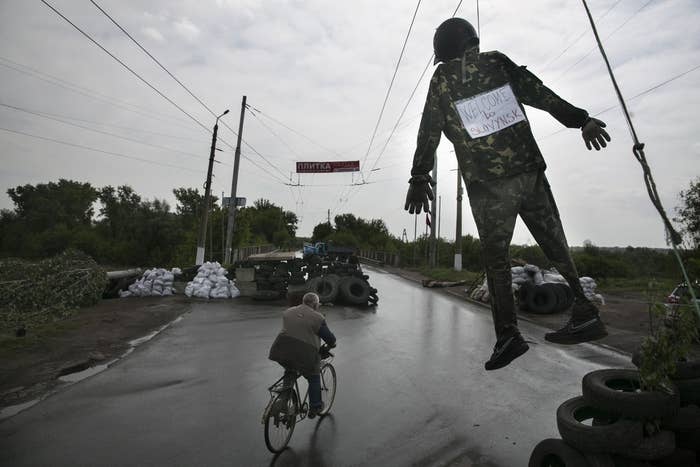 A figure hangs at a pro-Russia checkpoint near the town of Slovyansk in eastern Ukraine.