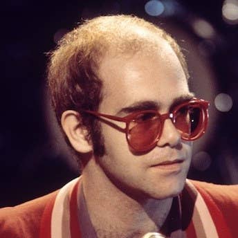Image result for elton john bald
