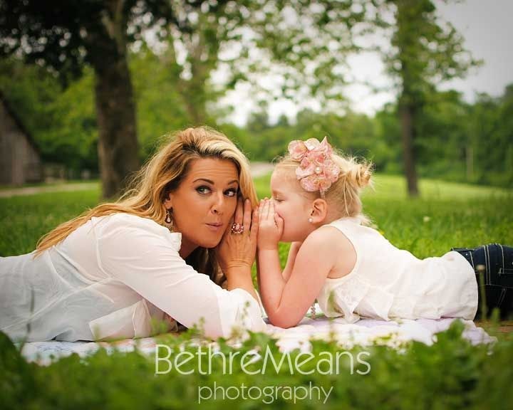 Indoor portrait of a beautiful mother with her charming little daughter  posing against bedroom interior Stock Photo - Alamy