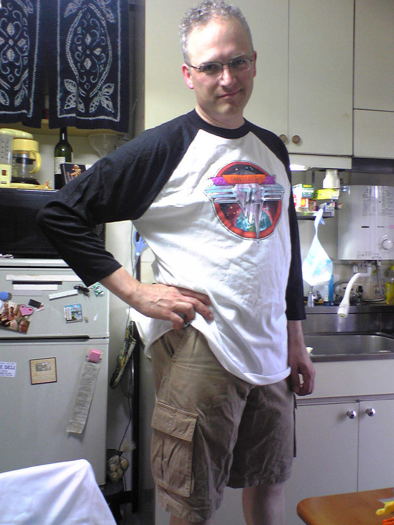OK, OK, it's pretty awesome that he bought the shirt at the show. But does he have to wear it with cargo shorts?