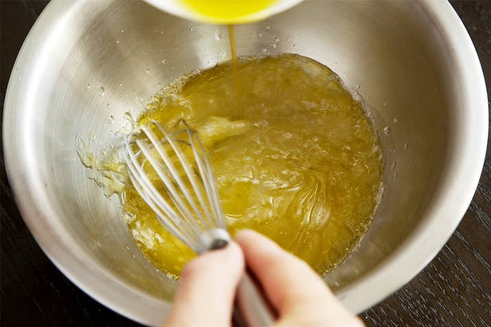 Then, add the oil really slowly, while whisking as fast as possible.