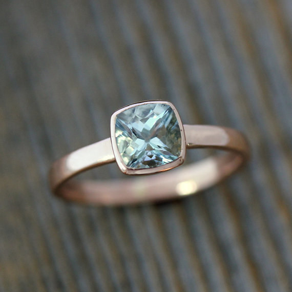 This aquamarine cushion gemstone set in recycled rose gold.