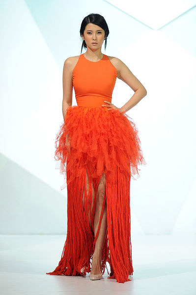 Lupita would look amazing in this bright orange piece.
