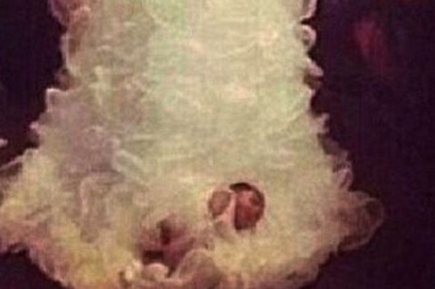 A Bride Actually Tied Her Baby To Her Wedding Dress Train And Dragged Her Down The Aisle