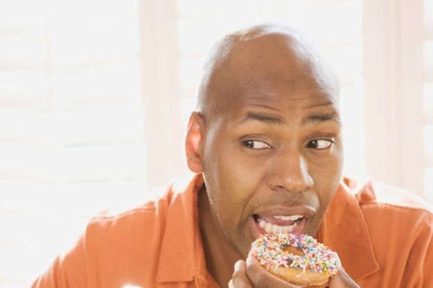 14 Sexy Stock Photos Of Men Eating Donuts.