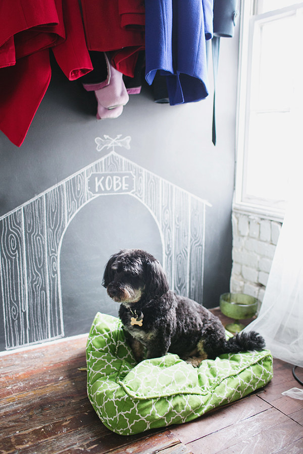 Kobe doesn't have to live up to your worldly standards. All he needs in this world is his comfy, on-trend bed and his chalk-drawn doghouse.If you wanna get real, build your dog a doghouse like your house