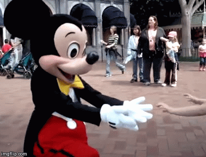 These costumes may be filled with sweaty teenagers, but it's hard to be cynical when you watch your wide-eyed kid meet Mickey Mouse.