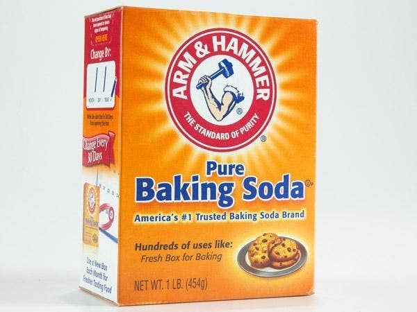 Make a paste with baking soda and a tiny bit of water in the shower and rub it through your hair, making sure you use your nails on your scalp. It won't strip your hair of its natural oils.